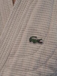 An Izod alligator patch on an aikido gi jacket