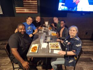 6 people at a table in a restaurant