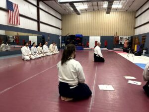 Aikidoka in Seiza before an exam