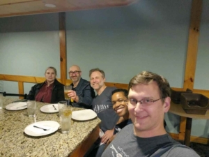 five people at a teppanyaki counter